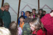Richard talking with children inside the tipi.